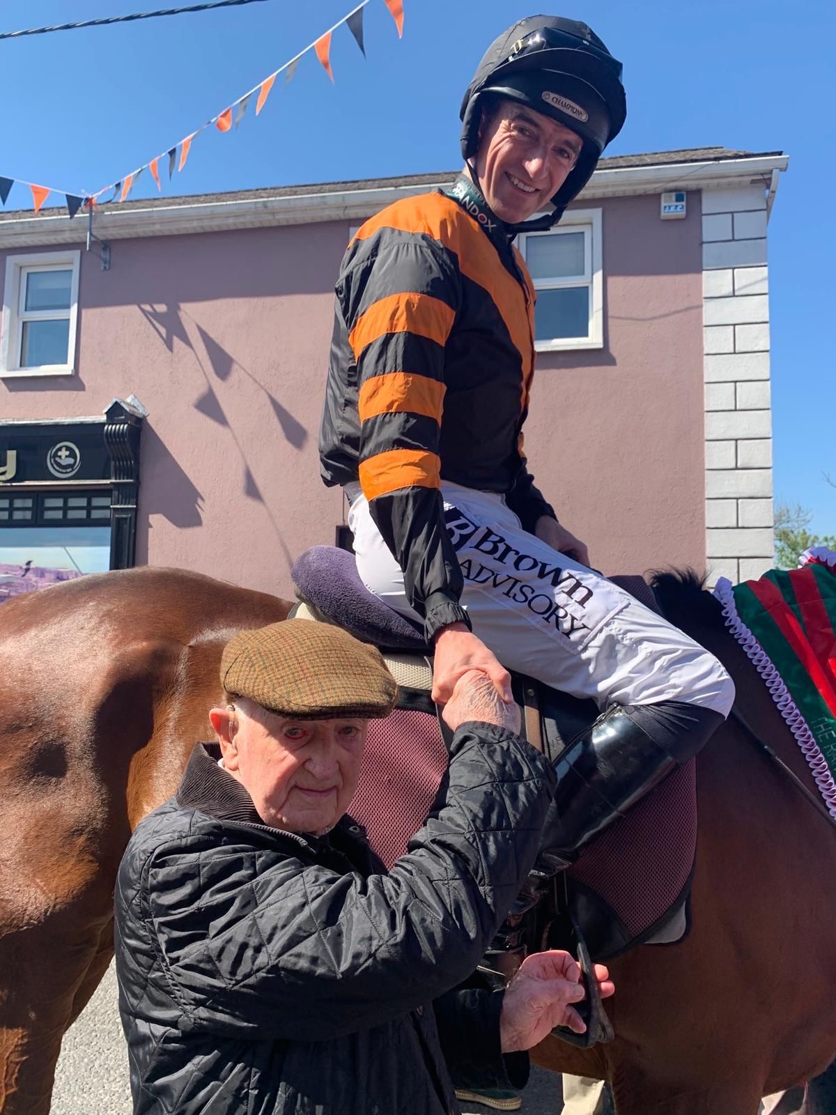 Michael Lenihan and winning jockey Patrick Mullins celebrating Nick Rockett